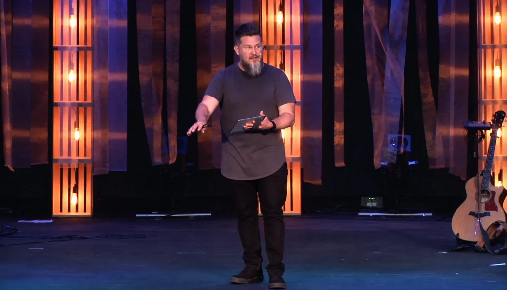 Brian Drinkwine teaching from a stage